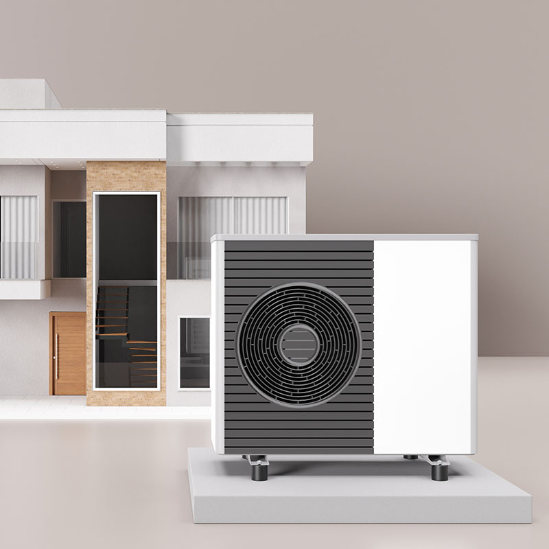 Makieta domu, przed nią stoi pompa ciepła